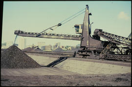 Port Elizabeth, September 1984. Stockpiling manganese at Port Elizabeth harbour. [Z Crafford]