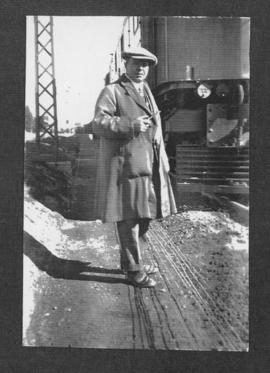 Circa 1925. Man next to electrical locomotive. (Album on Natal electrification)