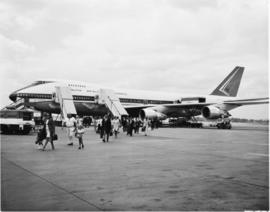 SAA Boeing 747 ZS-SAM 'Drakensberg' with passengers walking away.