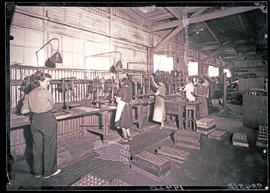 Female machinists in mechanical workshop.