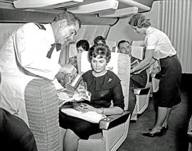 
SAA Boeing 707 interior. Meals served. Hostess and steward.
