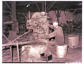 Springs, 1940. Steel cutting machine at engineering works.