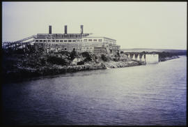 Power station on river bank.