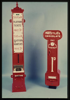 Dispensers for platform tickets and chocolates.