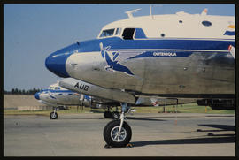 SAA Douglas DC-4 ZS-AUB 'Outeniqua' on tarmac with ZS-BMH 'Lebombo' behind.