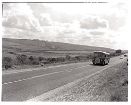 Bloemfontein district, 1963. SAR Bedford SB (1949 to 1952) MT16122 motor coach on open road.