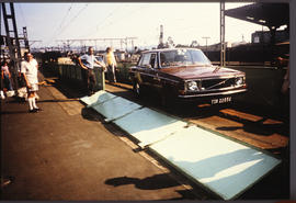 Durban, 1974. Offloading motor vehicle from Drakensberg passenger train at railway station.