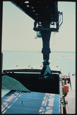 Richards Bay, November 1979. Discharging coal into ship hold at Richards Bay harbour. [De Waal Louw]