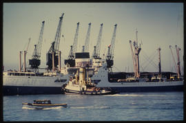 SAR tug assisting large ship.