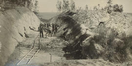 Workers excavating cutting.