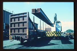 
Forklift loading beams on SAR type SF-1 double steel wagon.
