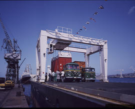 Durban, November 1971. Containers being loaded on SAR Foden trucks on container ship 'Voorloper'....