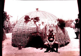 Swaziland, 1933. Elderly Swazi man in front of hut.