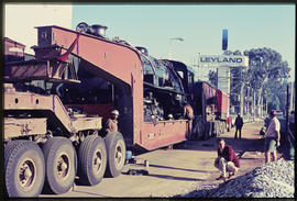 Loading of steam locomotive from SAR low bed trailer No MT23003 at Leyland workshop.