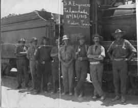 South-West Africa, 18 February 1915. Eight men of the SA Engineers in front of SAR Class 7 No 969...