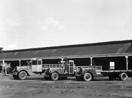 Johannesburg, 1934. Kazerne, new type of cartage truck under construction. L to R. Mack (?) and t...