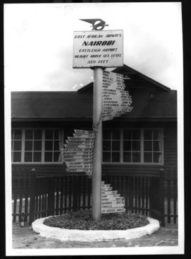 Nairobi, Kenya, September 1956. East African Airways distances signpost at Eastleigh.
