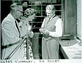 "Kimberley, 1956. De Beers official displaying diamonds."