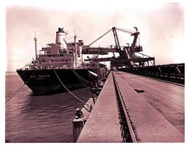 Saldanha Bay, 1977. Ore carrier 'Nai Marcus' loading ore at Saldanha Harbour.