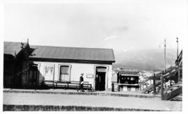 Cape Town. Woodstock station with post office and bookstall.