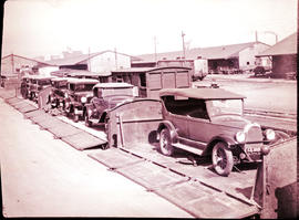 Johannesburg, 1929. Train of SAR Type DZ wagons loaded with motor cars.