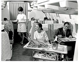 
SAA Boeing 707 interior. Cabin service. Hostess. Lobster.
