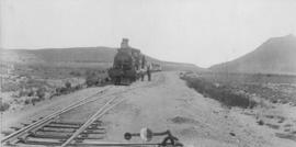 Noblesfontein, 1895. CGR 6th Class with train at station. (EH Short)