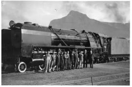Cape Town. SAR Class 15F with group of men posing.
