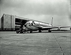 
SAA Boeing 707 ZS-CKC 'Johannesburg'. With tug outside hangar.
