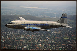 SAA Douglas DC-4 ZS-AUB 'Outeniqua' in flight. Note Blue and Silver Fleet colour scheme.