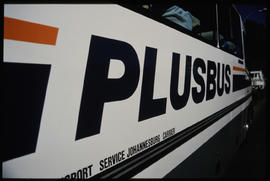 
Signage on side of SAR PLUSBUS tour bus.
