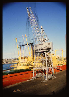 Port Elizabeth, Augustus 1985. Wharf crane in Port Elizabeth Harbour. [D Dannhauser]