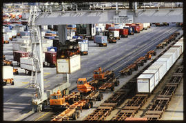 Container trains being loaded with gantry crane.