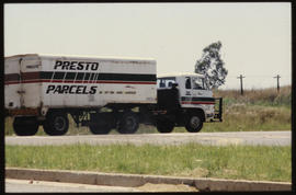 Road truck with Presto Parcels trailer.