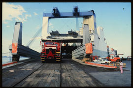 Richards Bay, April 1985. Abnormal load leaving 'Kolsnaren' RoRo ship in Richards Bay Harbour. [C...
