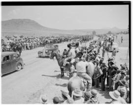 Basutoland, 11 March 1947. Motor cavalcade passing through welcoming crowd.