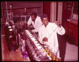 Chemists at work in analytical laboratory.