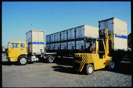 
Forklift loading container.
