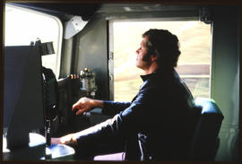 Driver at the controls of a locomotive.