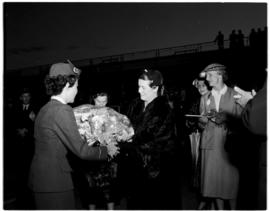 Cape Town, November 1955. Opening of DF Malan Airport. Hostess presenting flowers.