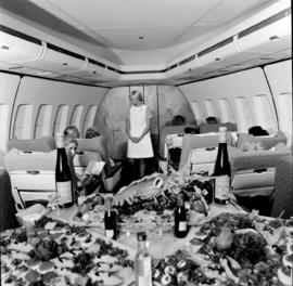 
SAA Boeing 747 interior. Cabin service. Hostess. Lobster.
