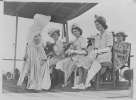 Standerton, 26 March 1947. Young girl in Voortrekker ceremonial outfit curtseys to Queen Elizabet...