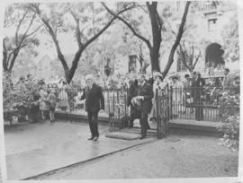 
Prime Minister Jan Smuts leading King George VI and Queen Elizabeth on their way to a church ser...