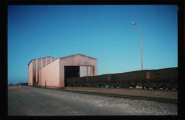 Saldanha, August 1977. Portal sheds over railway line leading into Saldanha Bay Harbour. [CJ Dann...