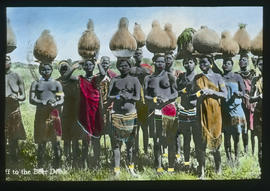 Zulu women with baskets on heads.