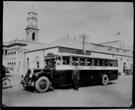 Durban, 1930. SAR MACK bus with driver destined for Pietermaritzburg, post office in the background.