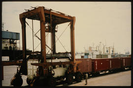 Straddle carrier in harbour.
