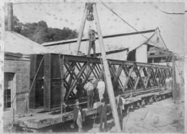 Inchanga. Steel trusses loaded onto train wagon.