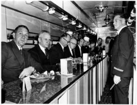 Johannesburg, September 1957. Group of dignitaries in a self-service diner of a cafeteria special...