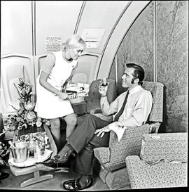
SAA Boeing 747 interior. Cabin service. Hostess. Magazines.

